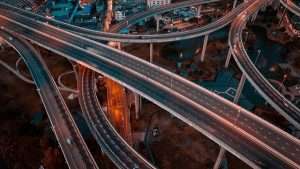 Aerial view of intricate highway interchanges at twilight