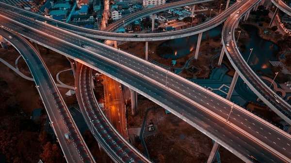 Aerial view of intricate highway interchanges at twilight